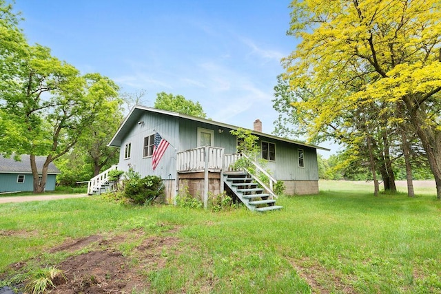 25431 Larch St NW, Isanti, MN 55040 - view of front facade with a chimney and a front yard