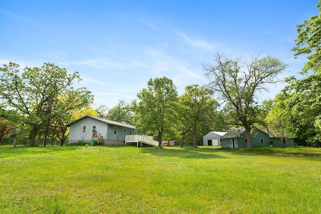 25431 Larch St NW, Isanti, MN 55040 - view of grassy yard with a wooden deck