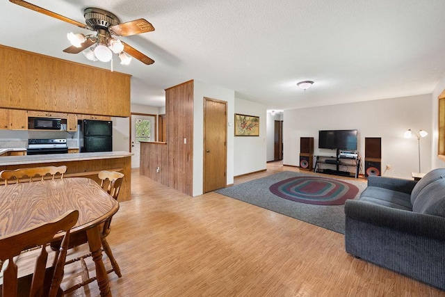 25431 Larch St NW, Isanti, MN 55040 - living room with a ceiling fan and light wood finished floors
