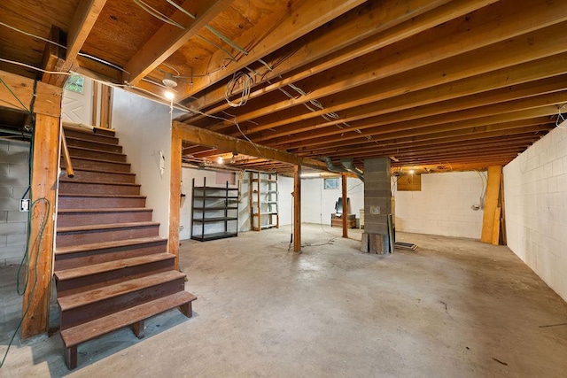 25431 Larch St NW, Isanti, MN 55040 - unfinished basement with stairs and concrete block wall