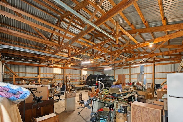 25431 Larch St NW, Isanti, MN 55040 - garage with freestanding refrigerator and metal wall