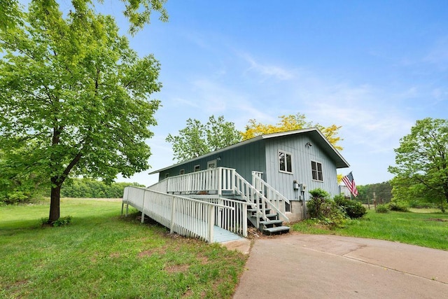 25431 Larch St NW, Isanti, MN 55040 - view of front of home featuring a front yard and board and batten siding
