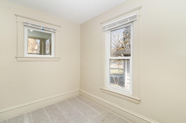 1040 26th Ave SE, Minneapolis, MN 55414 - empty room with baseboards and carpet