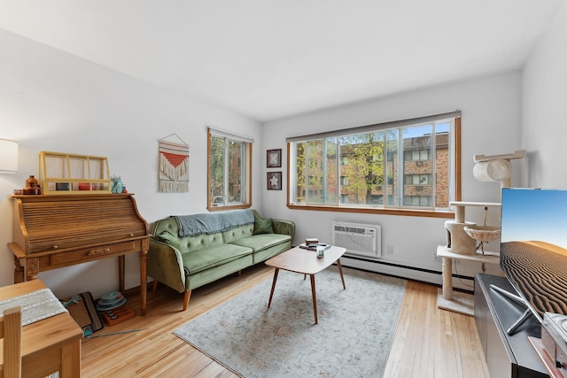 2112 Garfield Ave Unit 6, Minneapolis, MN 55405 - living area with an AC wall unit, a baseboard heating unit, and wood finished floors