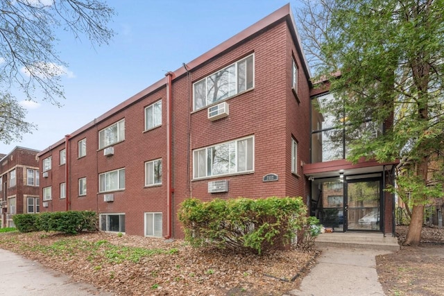 2112 Garfield Ave Unit 6, Minneapolis, MN 55405 - view of building exterior with an AC wall unit