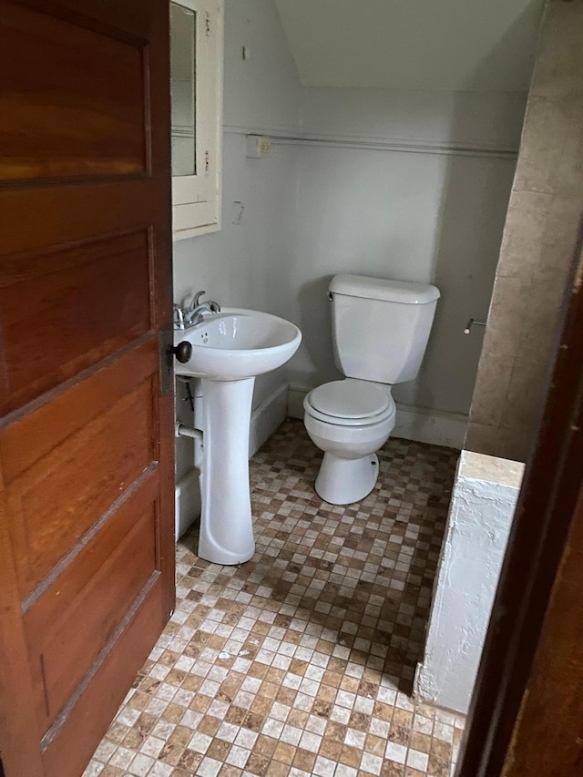 bathroom featuring toilet and a sink