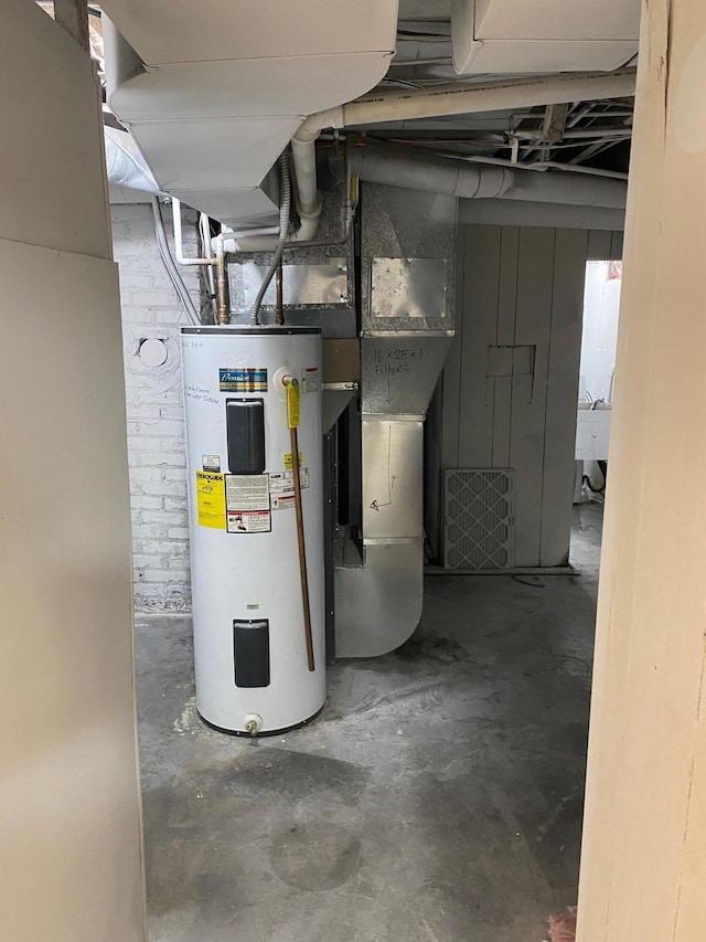 utility room with electric water heater