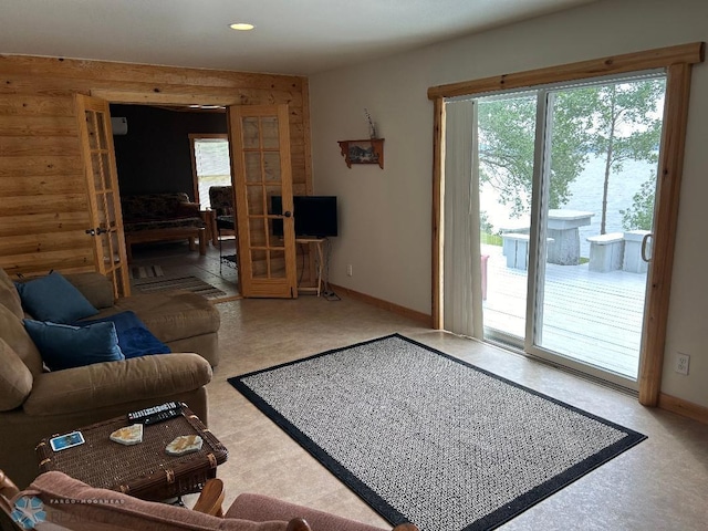 23062 Gosslee Ln, Dunn Twp, MN 56501 - living room with baseboards, french doors, recessed lighting, and wooden walls