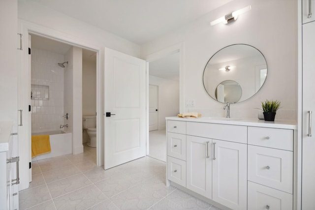 4717 Meadow Rd, Edina, MN 55424 - bathroom with vanity, toilet, shower / bathtub combination, and tile patterned flooring