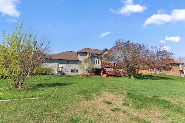 view of yard featuring a wooden deck