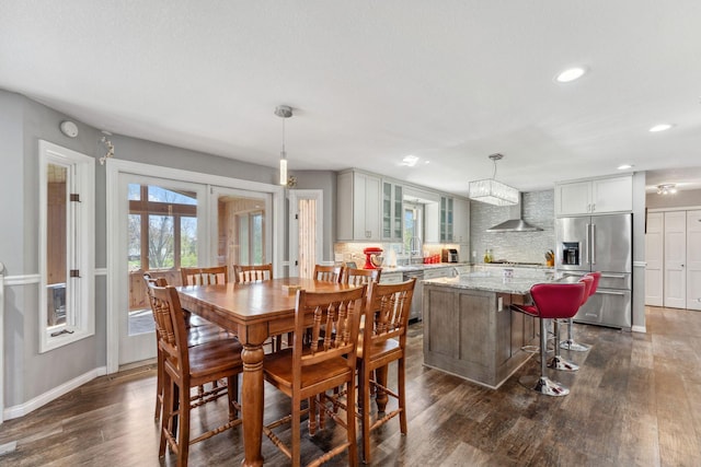 dining space with baseboards, french doors, recessed lighting, and dark wood-type flooring