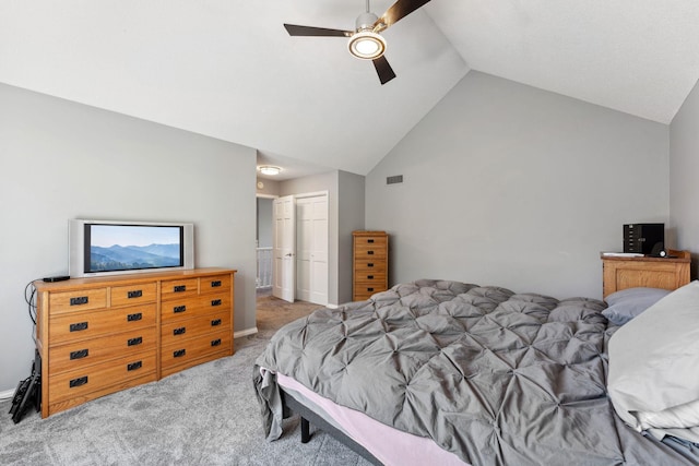 bedroom with visible vents, carpet floors, a closet, high vaulted ceiling, and a ceiling fan