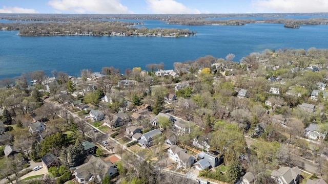 birds eye view of property with a water view and a residential view