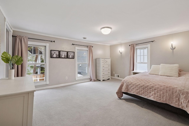 bedroom with baseboards, multiple windows, light carpet, and visible vents