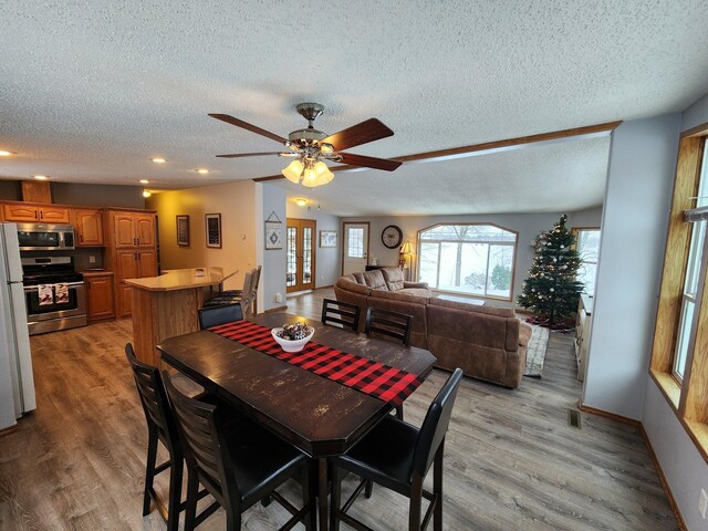 20361 Rolling Acres Dr, Eden Lake Twp, MN 56368 - dining room featuring a textured ceiling, ceiling fan, light wood-style floors, recessed lighting, and baseboards