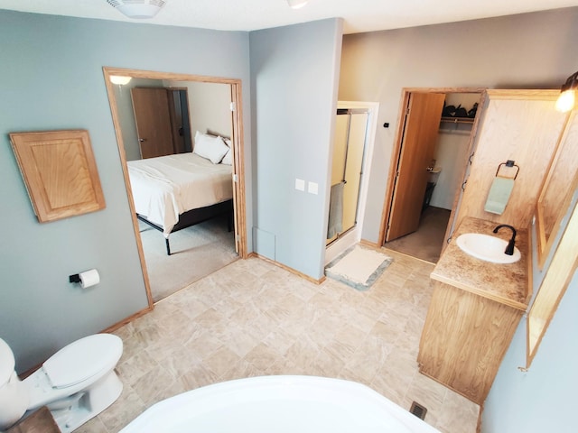 20361 Rolling Acres Dr, Eden Lake Twp, MN 56368 - full bathroom with a stall shower, toilet, vanity, and baseboards