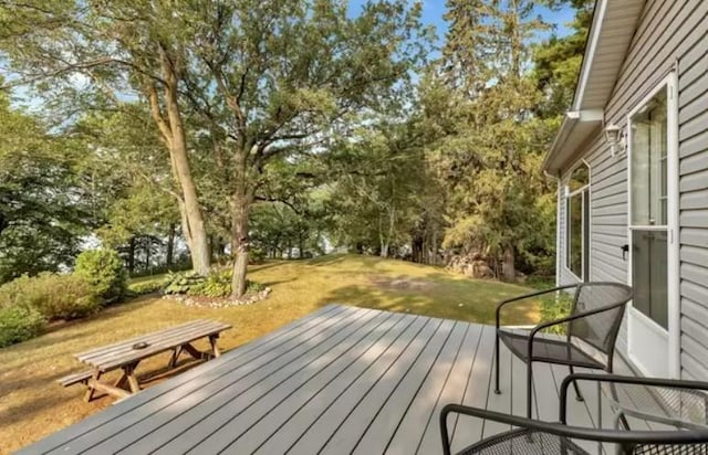20361 Rolling Acres Dr, Eden Lake Twp, MN 56368 - wooden deck featuring view of wooded area and a yard