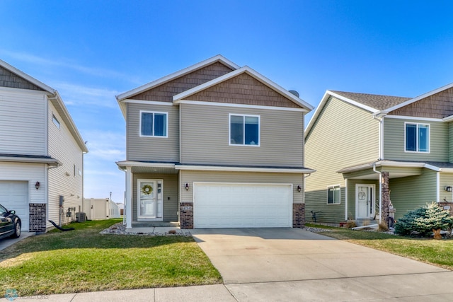 craftsman inspired home featuring an attached garage, a front yard, brick siding, and concrete driveway