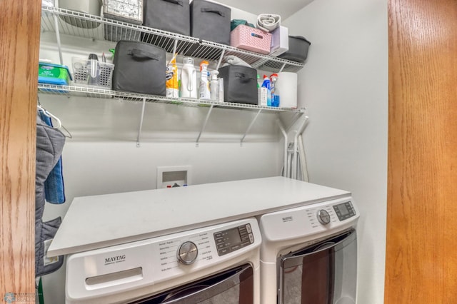 clothes washing area featuring laundry area and independent washer and dryer