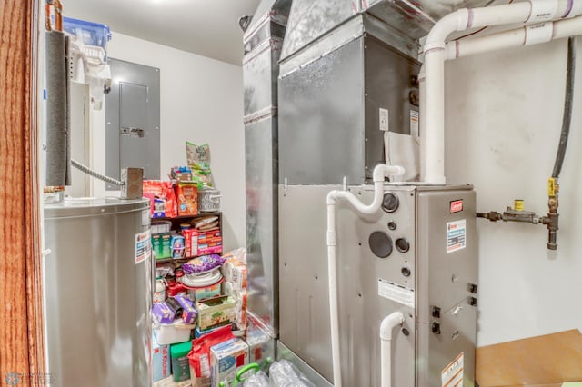 utility room with water heater, heating unit, and electric panel