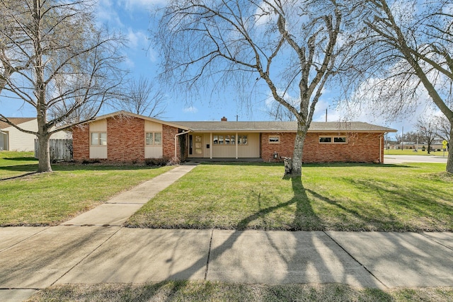 420 6th Ave N, Cold Spring, MN 56320 - ranch-style house featuring a front lawn and brick siding
