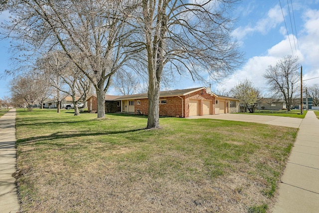 420 6th Ave N, Cold Spring, MN 56320 - view of side of home with a lawn, driveway, an attached garage, and brick siding