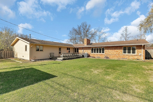 420 6th Ave N, Cold Spring, MN 56320 - back of house featuring a chimney, fence, a wooden deck, and central AC unit