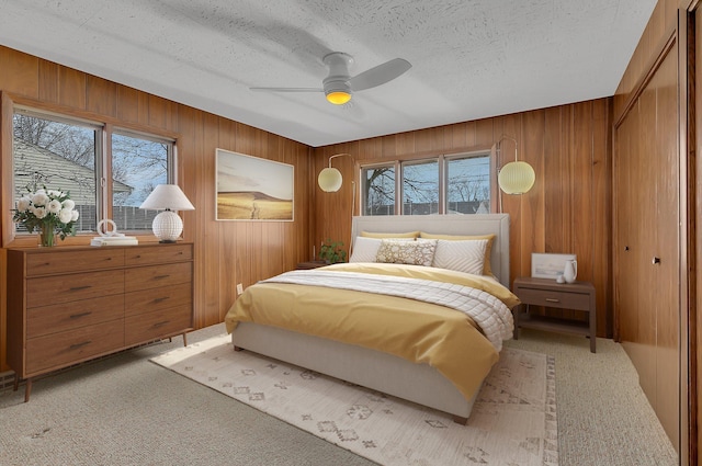 420 6th Ave N, Cold Spring, MN 56320 - bedroom featuring a textured ceiling, multiple windows, and light carpet