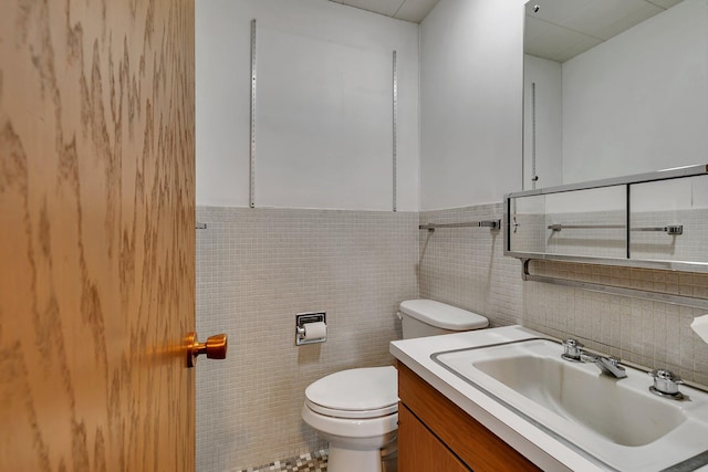 420 6th Ave N, Cold Spring, MN 56320 - bathroom featuring tile walls, toilet, and vanity