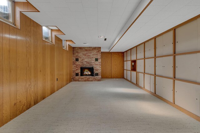 420 6th Ave N, Cold Spring, MN 56320 - basement featuring wood walls and a brick fireplace