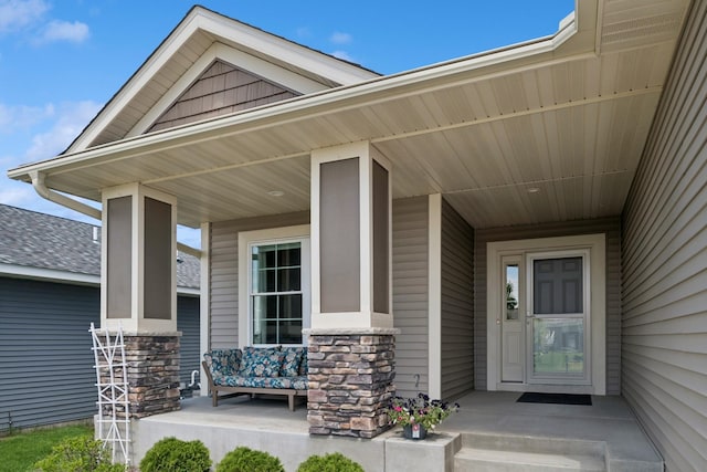 1703 11th St NE, Buffalo, MN 55313 - property entrance with a porch and stone siding