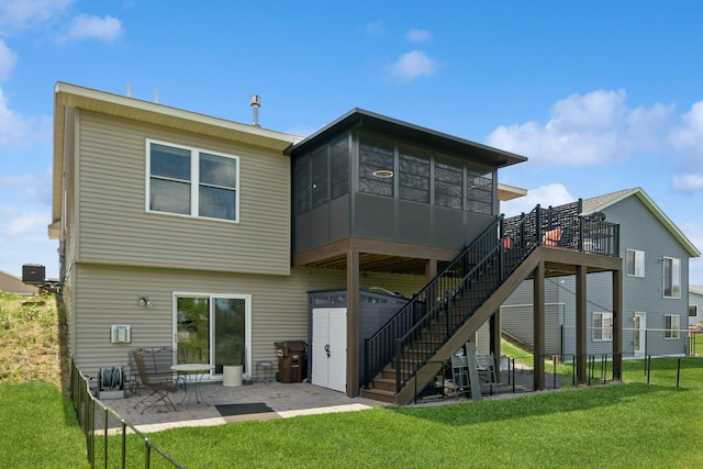 1703 11th St NE, Buffalo, MN 55313 - rear view of house featuring stairway, a patio area, a sunroom, and a wooden deck