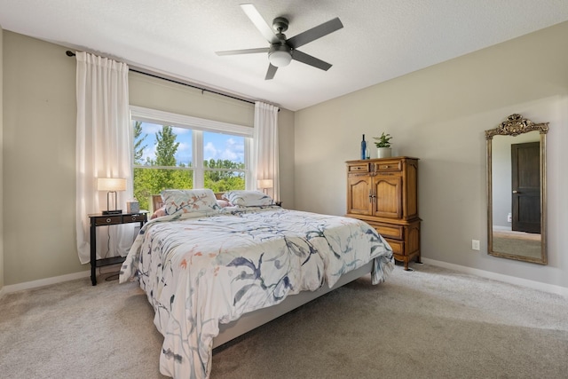 1703 11th St NE, Buffalo, MN 55313 - bedroom with light colored carpet, ceiling fan, and baseboards