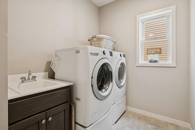 1703 11th St NE, Buffalo, MN 55313 - laundry area featuring washing machine and clothes dryer, cabinet space, and baseboards