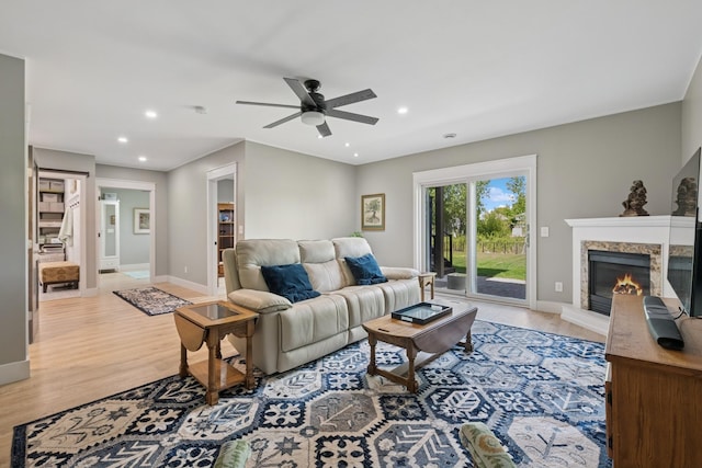 1703 11th St NE, Buffalo, MN 55313 - living area with a ceiling fan, light wood-style floors, baseboards, a glass covered fireplace, and recessed lighting