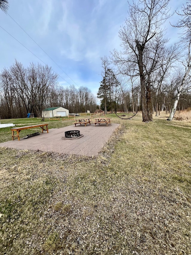 view of yard with an outdoor fire pit