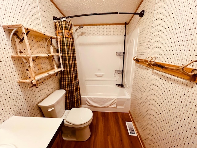 full bathroom featuring shower / tub combo, visible vents, toilet, wood finished floors, and vanity