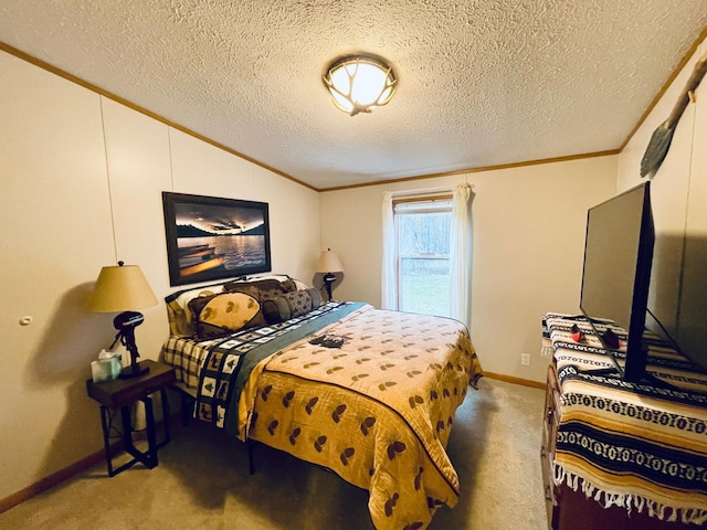 carpeted bedroom featuring baseboards, ornamental molding, a textured ceiling, and vaulted ceiling