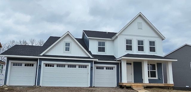 17121 61st St NE, Otsego, MN 55330 - view of front facade featuring covered porch, board and batten siding, driveway, and roof with shingles
