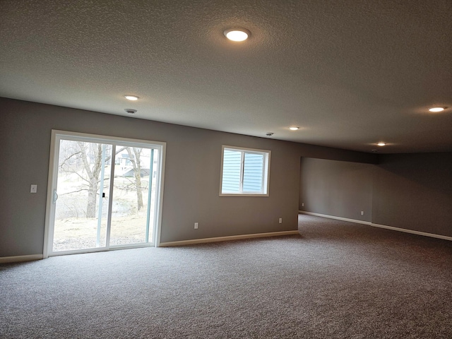 17121 61st St NE, Otsego, MN 55330 - spare room featuring carpet floors, a textured ceiling, and baseboards