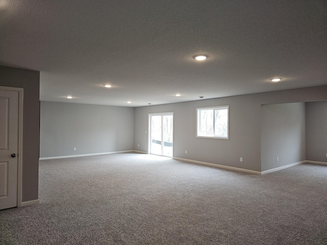 17121 61st St NE, Otsego, MN 55330 - unfurnished room with recessed lighting, a textured ceiling, carpet, and baseboards