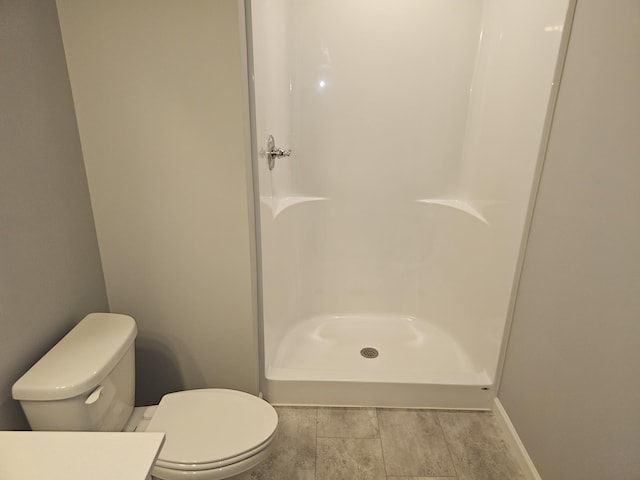 17121 61st St NE, Otsego, MN 55330 - bathroom with baseboards, a shower, and toilet