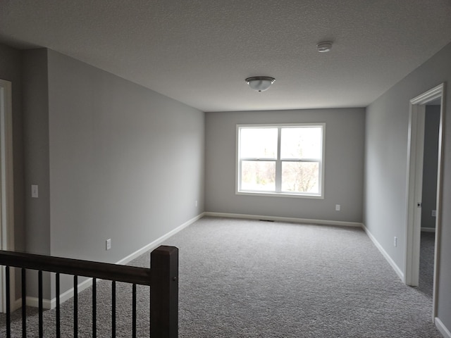 17121 61st St NE, Otsego, MN 55330 - carpeted spare room with baseboards and a textured ceiling