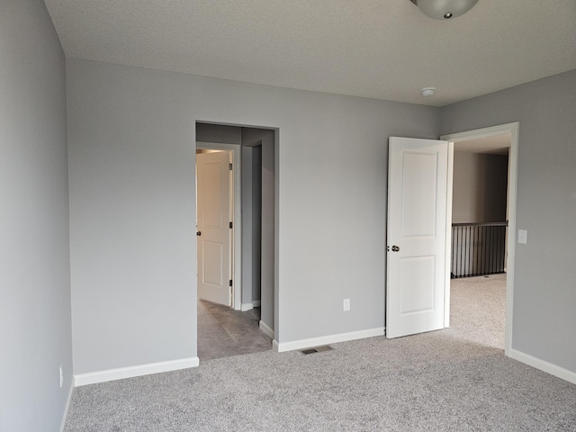 17121 61st St NE, Otsego, MN 55330 - unfurnished bedroom with visible vents, carpet, and baseboards