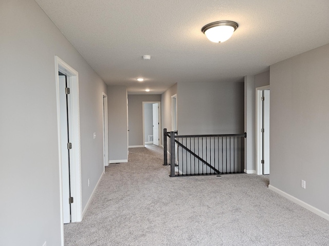 17121 61st St NE, Otsego, MN 55330 - carpeted empty room featuring a textured ceiling, visible vents, and baseboards