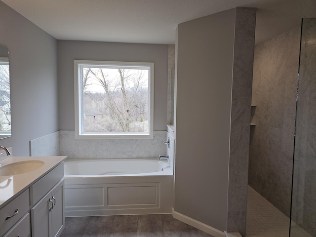17121 61st St NE, Otsego, MN 55330 - full bathroom with a walk in shower, a bath, and vanity