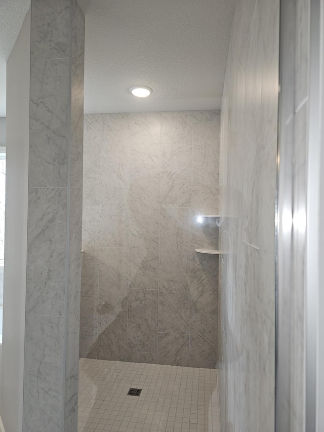 17121 61st St NE, Otsego, MN 55330 - bathroom featuring recessed lighting, a textured ceiling, and a tile shower