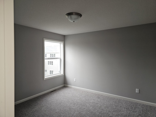 17121 61st St NE, Otsego, MN 55330 - spare room featuring carpet flooring, baseboards, and visible vents