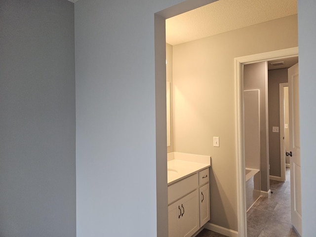 17121 61st St NE, Otsego, MN 55330 - full bathroom with a tub, vanity, and baseboards