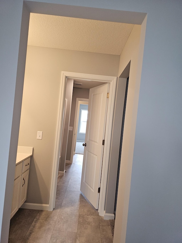 17121 61st St NE, Otsego, MN 55330 - hallway with a textured ceiling and baseboards